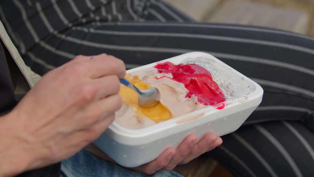Couple eating ice cream on hot summer day