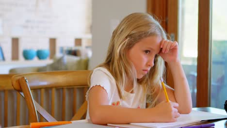 girl doing her homework at home 4k