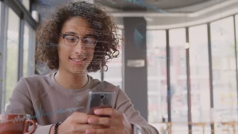 Animation-Der-Finanzdatenverarbeitung-über-Einen-Biracial-Mann,-Der-Im-Büro-Ein-Smartphone-Nutzt