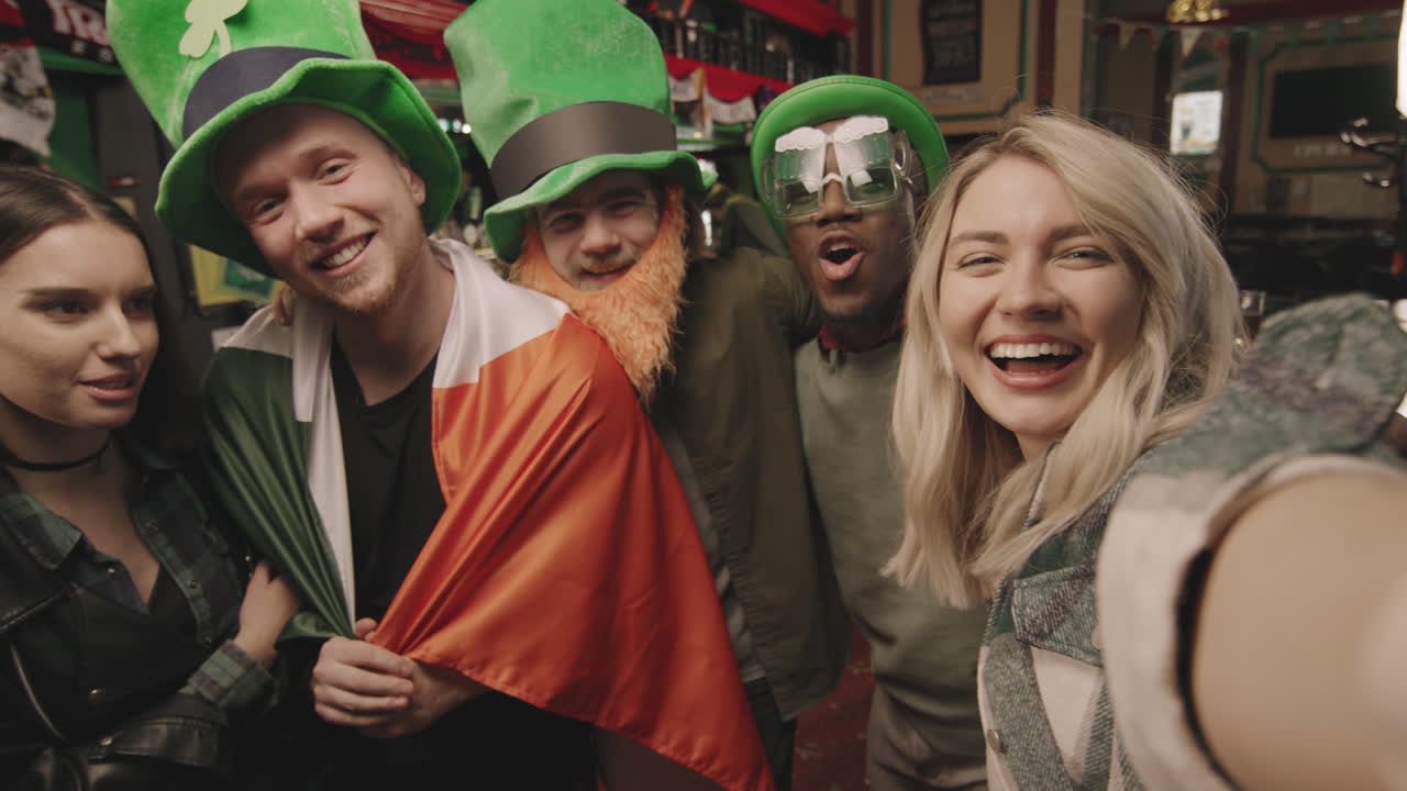 POV Of Happy Friends In Bar On St Patricks Day