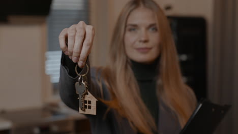 real estate agent posing with keys