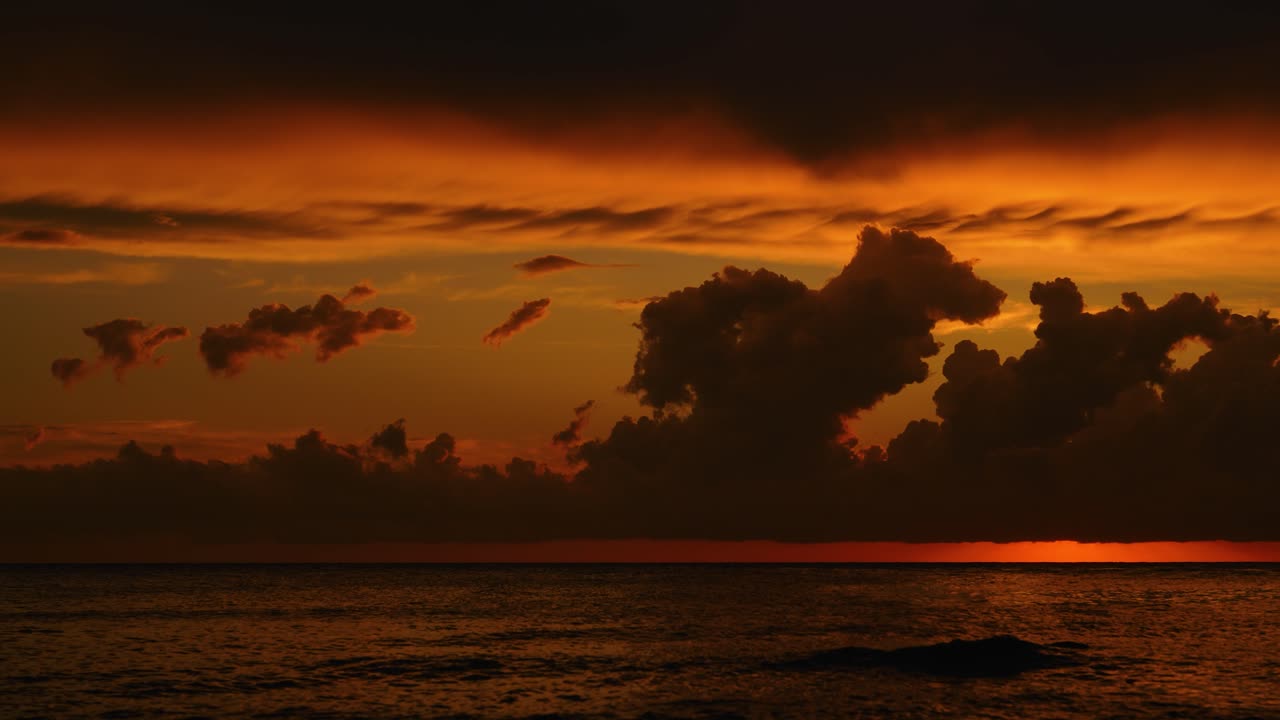 Time lapse of beautiful sunset sky with moving clouds and dark sea reflections in Istria, Croatia
