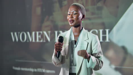 woman giving a presentation at a conference