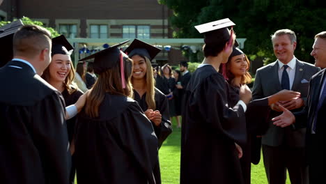 graduates celebrating on a university campus