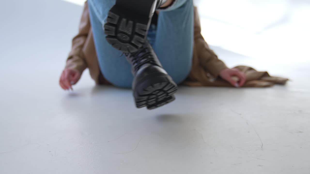 Woman Wearing Black Platform Boots and Jeans