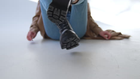 woman wearing black platform boots and jeans