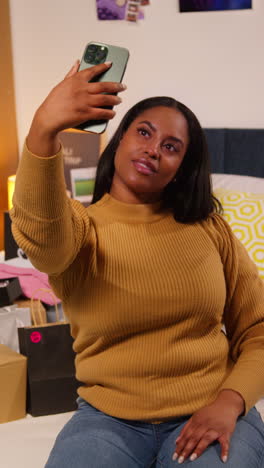 woman taking a selfie in her bedroom