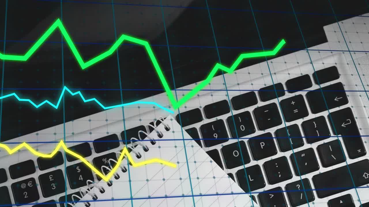Initial grid appearing under laptop keyboard and notebook, graphs animating visualizing data trends