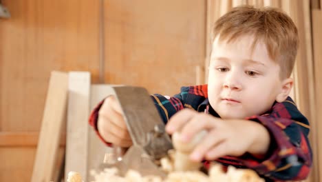 young boy learning woodworking