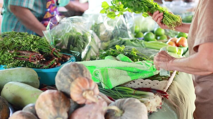 Buying fresh vegetables at a vibrant market