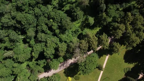 Aerial-view-of-Diklu-Stage-in-Dikli-village,-showcasing-the-open-air-performance-venue-surrounded-by-lush-greenery-and-nearby-buildings