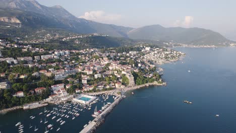 aerial: škver harbor, herceg novi, montenegro with boats and mountains