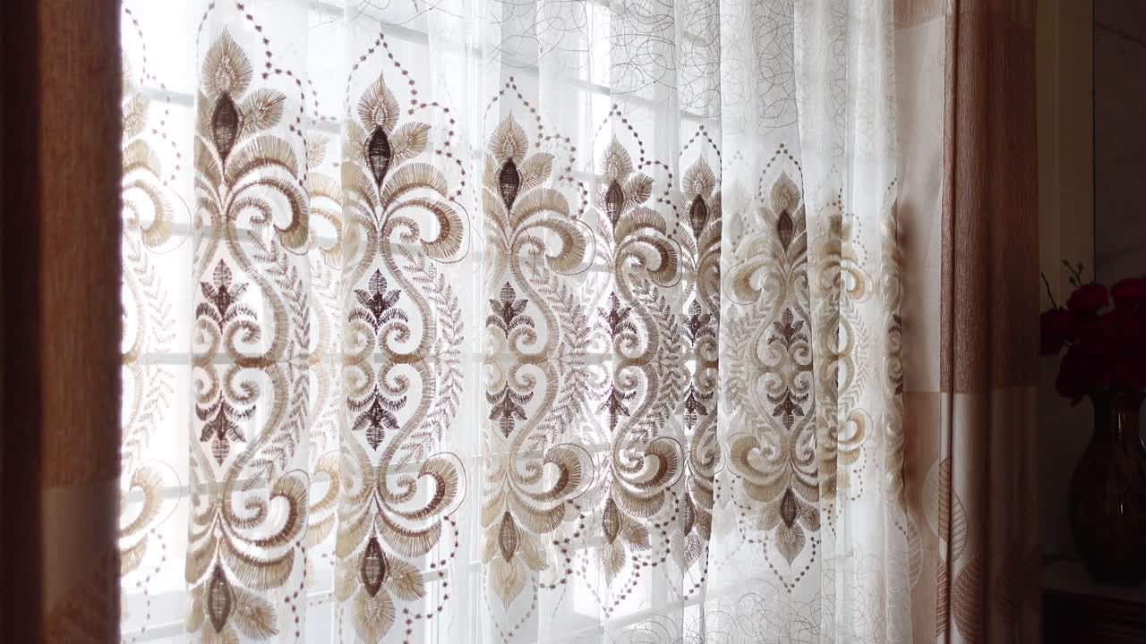 Close-up of Ornate Sheer Curtains with Embroidered Pattern