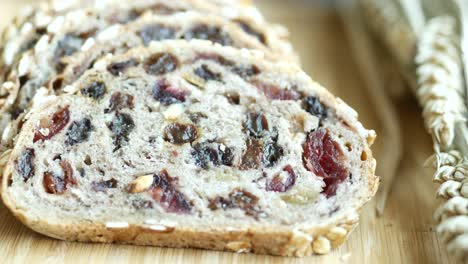 sliced fruit bread on a wooden board