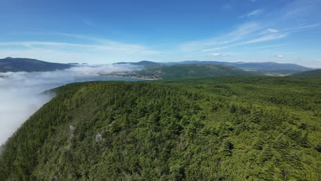 enjoy nature’s peace as the camera sweeps over lush hills and distant mountains