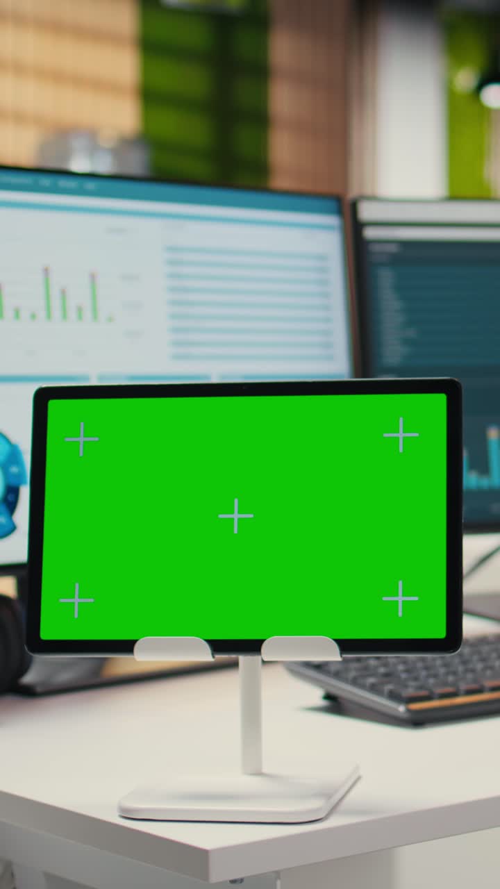 Vertical Video Empty office showcases tablet with isolated chroma key and modern tools