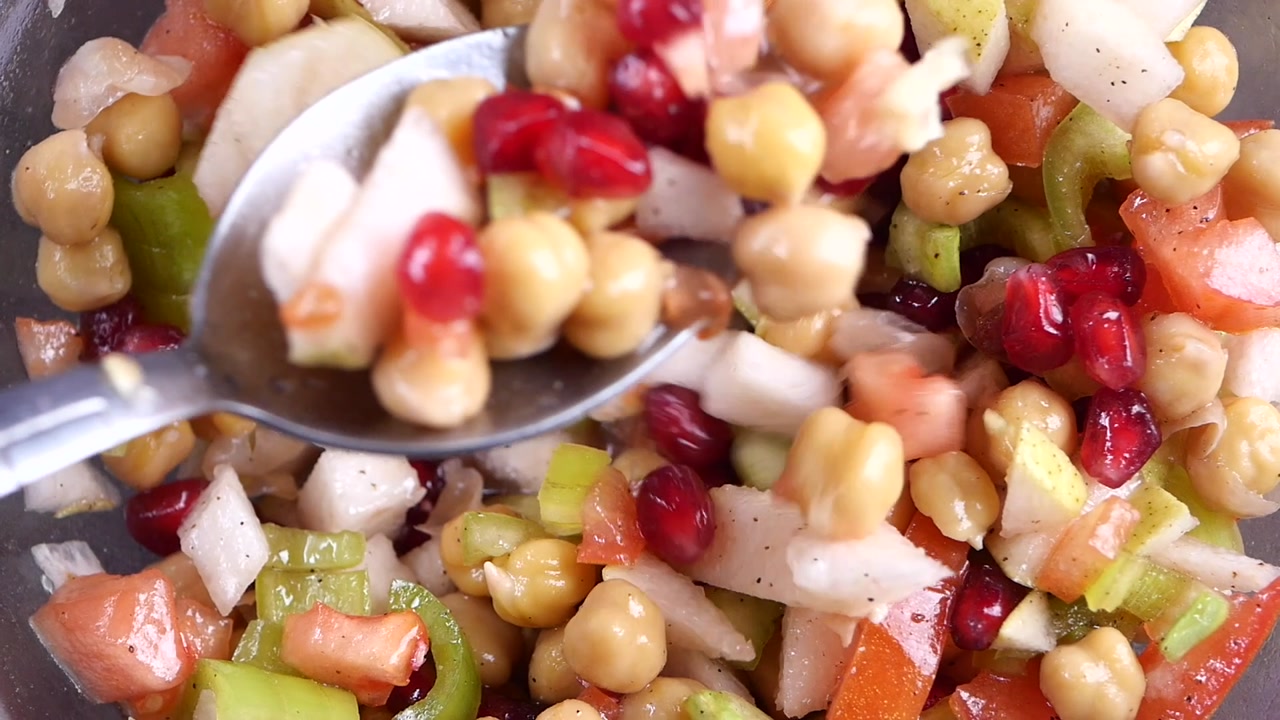Close-up of Fresh Chickpea Salad with Pomegranate and Apple