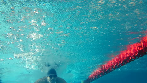 underwater view of man swimming