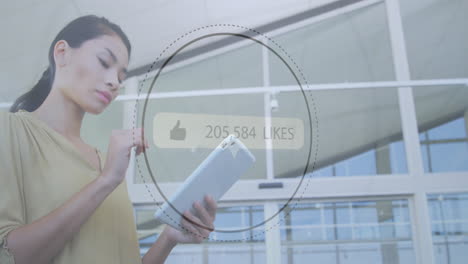 animation of likes growing number over biracial businesswoman using tablet