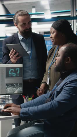 vertical video multiethnic team of experts collaborating in a solar panel power plant