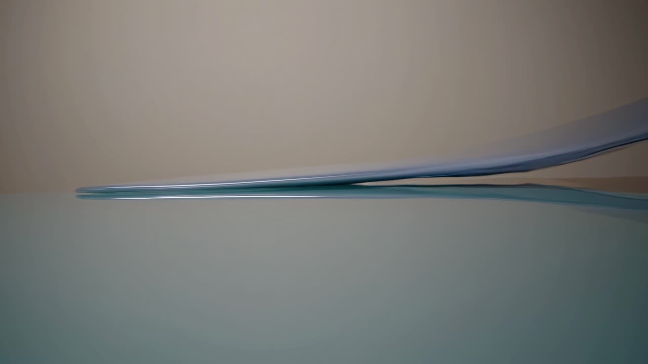 Abstract Motion of Blue Flexible Sheet on Reflective Surface
