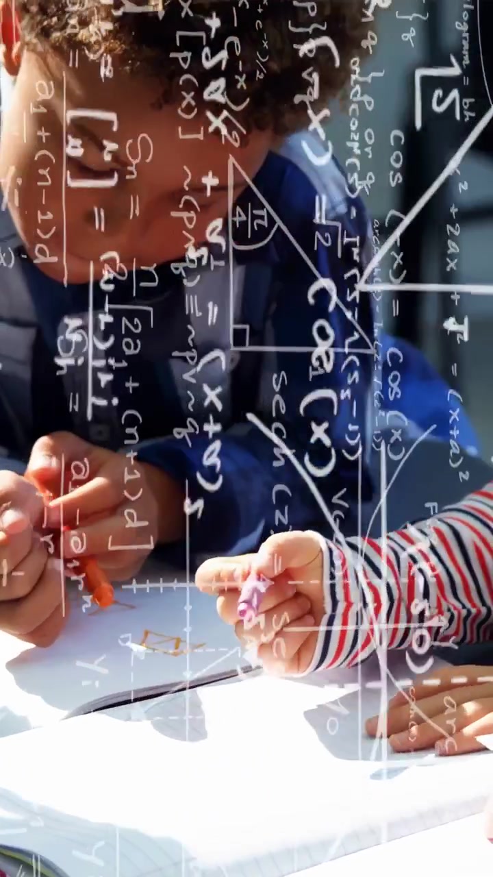Vertical video: Boy writing with orange pen, peer reaching to erase, equations overlaying education