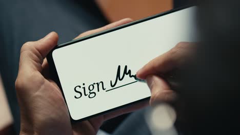 business man digital signature on smartphone