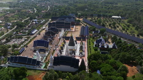 wat ban den buddhist temple and village in daytime in inthakhin, chiang mai province, thailand. - aerial shot
