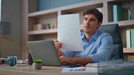tired manager solving problem in contemporary office. stressed man throw papers