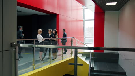 business people meeting in modern office corridor