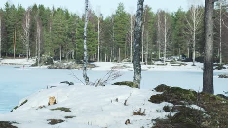 Kids-playing-on-frozen-lake-in-summer-winter-day-in-Norway