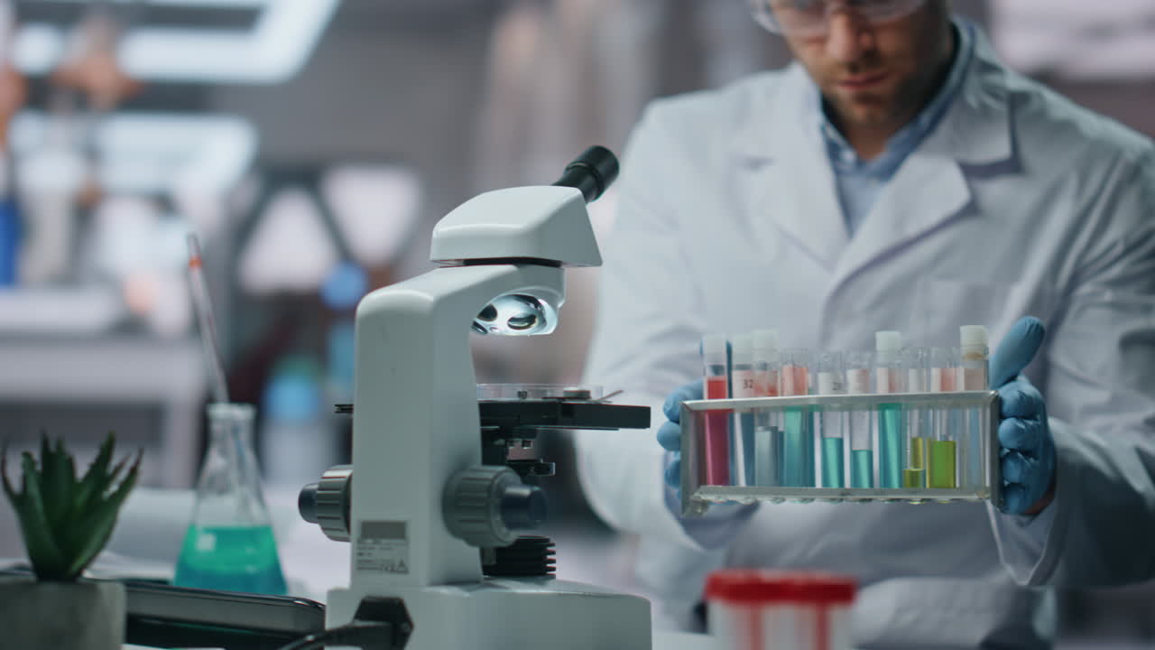 Biochemistry specialist making expertise drug samples in laboratory close up.