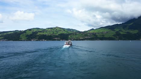 tilt up drone shot of a big white boat on thun lake in switzerland in canton of bern