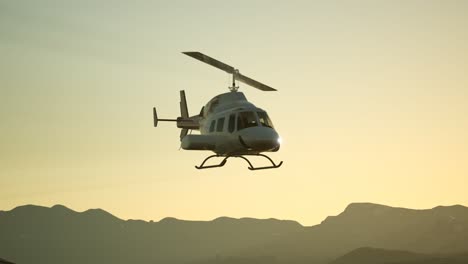 extreme slow motion flying helicopter and sunset sky