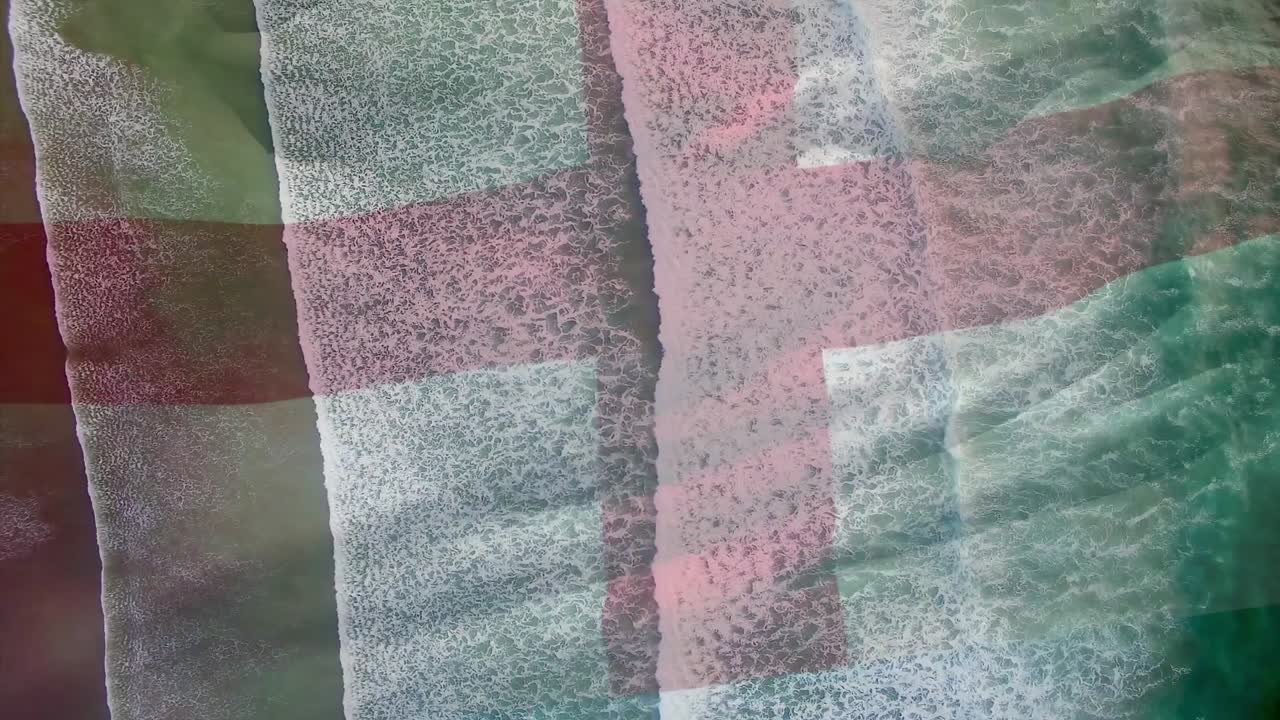 animación de la bandera de inglaterra soplando sobre las olas en el mar