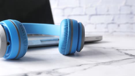 blue headphones on a laptop