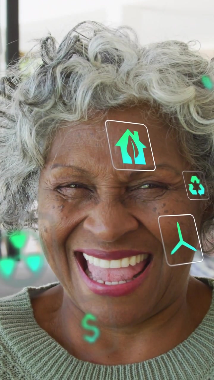Vertical video: Senior woman laughing while green AR icons floating overlaying face, showing energy