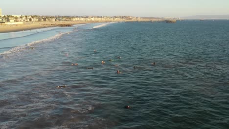 surfers swimming out sea