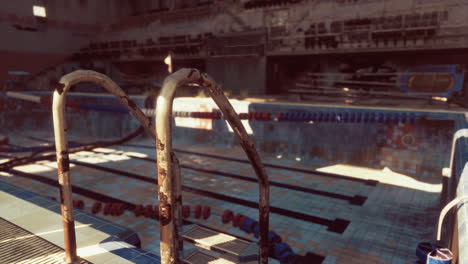 abandoned swimming pool with rusted ladder