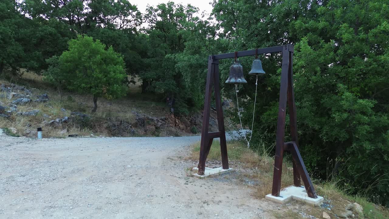 Orthodox Christian church bells on wood frame Greece countryside rural faith religion