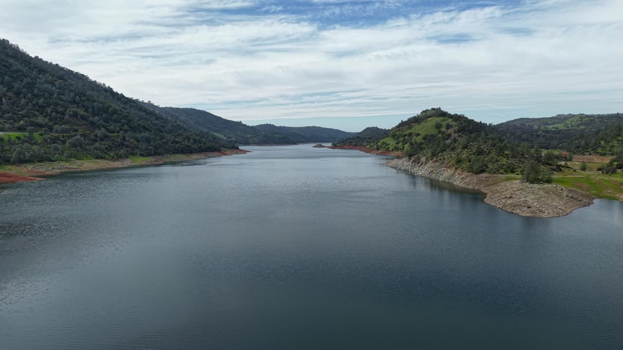 Aerial zoom out capturing the Don Pedro Reservoir in Jamestown California.