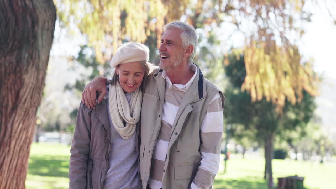 Affectionate Senior Couple Enjoying a Walk in the Park