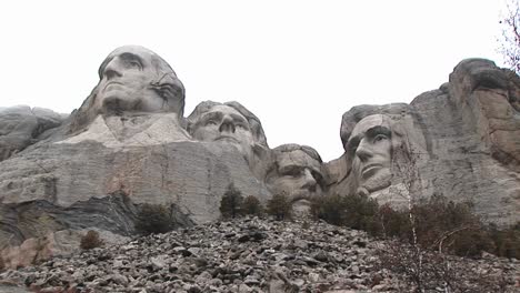 a worm's eye montage of mt rushmore from unusual perspective