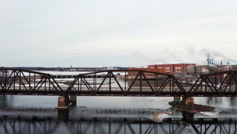 aerial, frozen wisconsin river, revealing downtown stevens point during winter