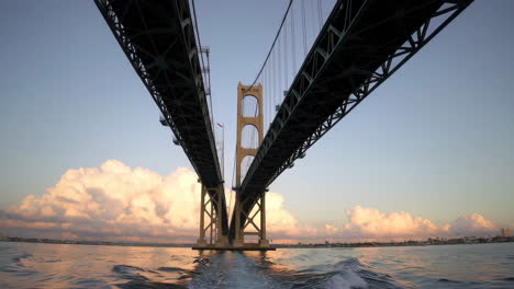 boating under the golden gate bridge at sunset