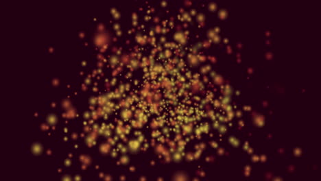 animación de manchas amarillas y rojas de luz volando en movimiento hipnótico sobre fondo negro