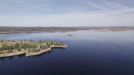 Aerial-view-orbiting-scenic-blue-Almonte-river,-Caceres,-in-the-Tajo-tributary