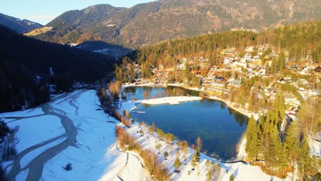 Aerial-4K-drone-footage-of-lake-Jasna,-Slovenia-in-the-winter