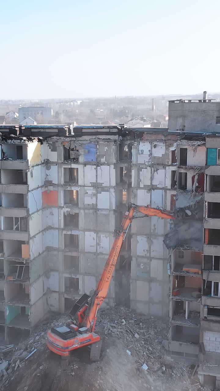 Dismantling of a house. Destroying Old House With Bulldozer Mechanical Arm