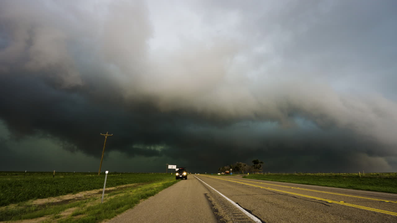 Drivers Flee From A Threatening Stormy Sky Aproaching